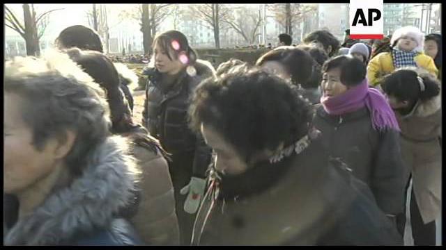People crying on the streets after death of Kim Jong-Il People crying on the streets after death of Kim Jong-Il