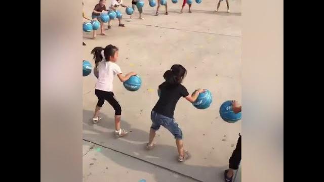 Kindergarten kids master basketball bouncing game Kindergarten kids master basketball bouncing game