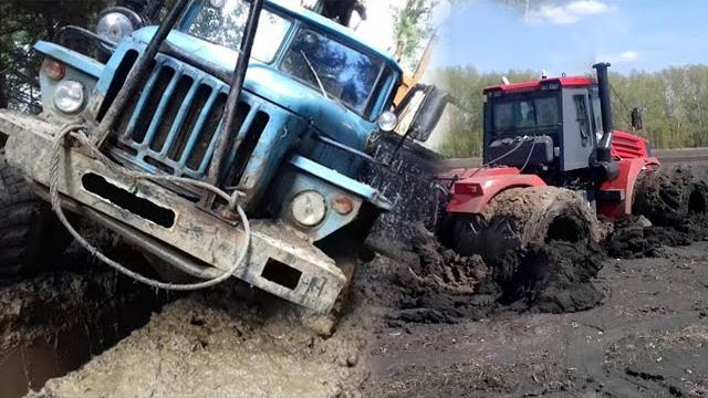 Застрявшие грузовики и трактора в грязи. Застрявшие грузовики и трактора в грязи.