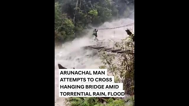 Arunachal Pradesh Floods: Man Crosses Hanging Bridge Amid Torrential Rain, Flooded River Arunachal Pradesh Floods: Man Crosses Hanging Bridge Amid Torrential Rain, Flooded River