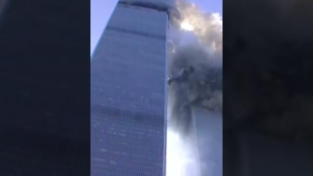 Reporter on camera as tower begins to collapse Reporter on camera as tower begins to collapse