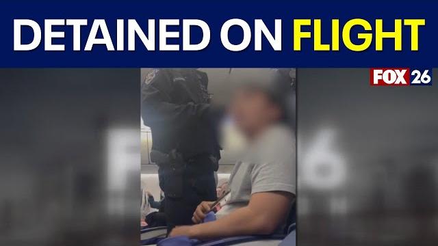 Houston-bound plane diverts to Seattle after passenger tries opening exit door mid-flight Houston-bound plane diverts to Seattle after passenger tries opening exit door mid-flight