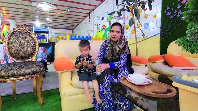 "Razieh and Abu's trip to the city to buy special fabrics for the side and reception pillows" "Razieh and Abu's trip to the city to buy special fabrics for the side and reception pillows"