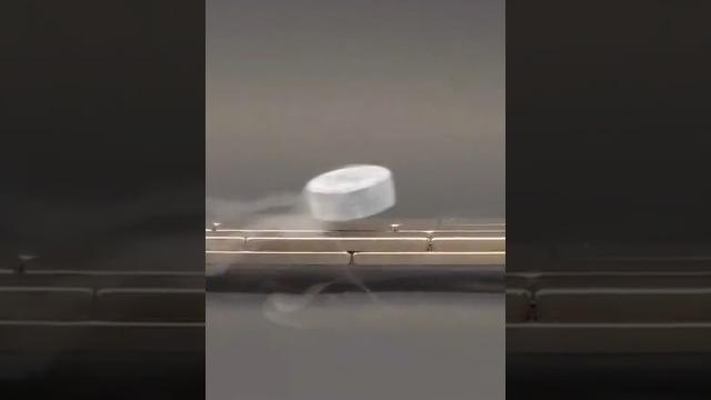 Watch this superconductor hover around in mid-air! Watch this superconductor hover around in mid-air!